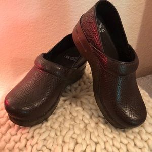 Dansko brown woven clogs.